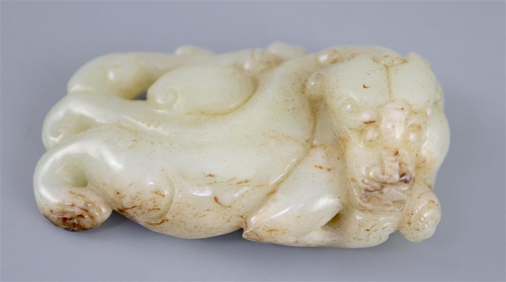 A Chinese pale celadon jade figure of a chilong, 10.2cm